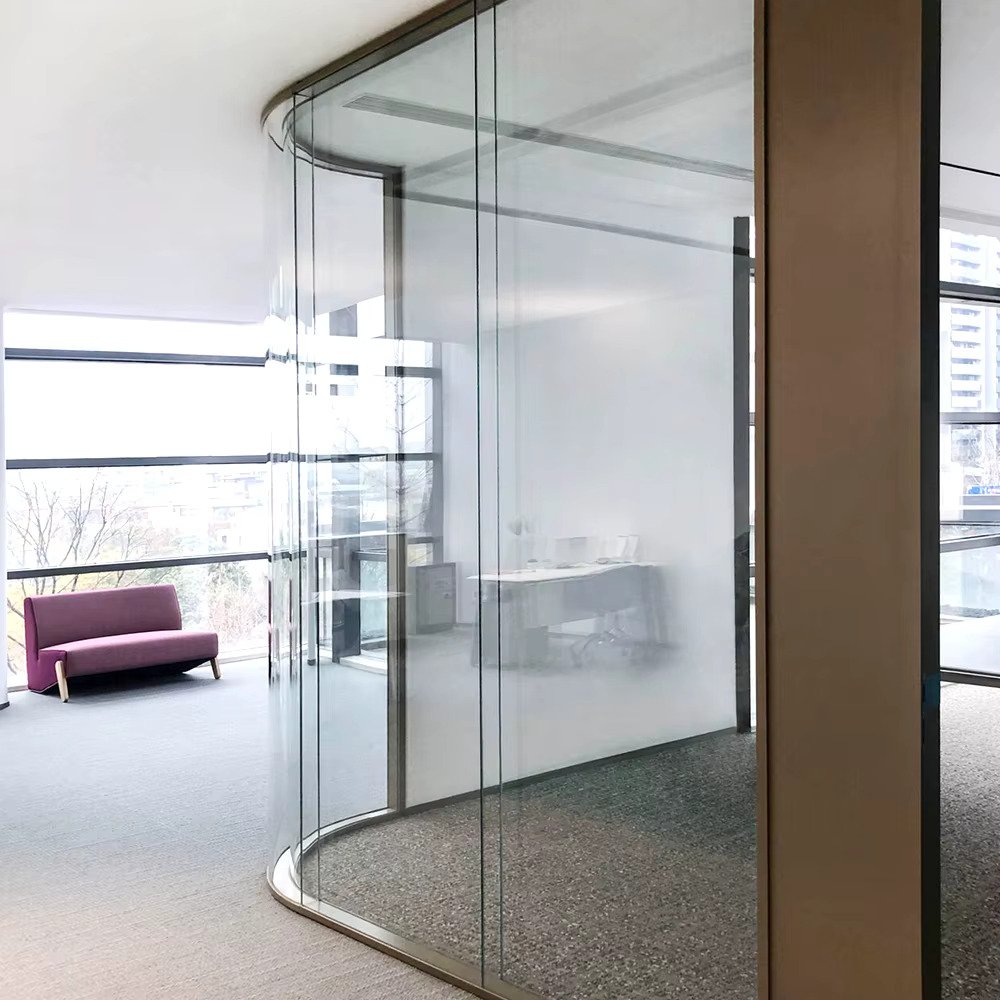 Curved glass partition in modern office