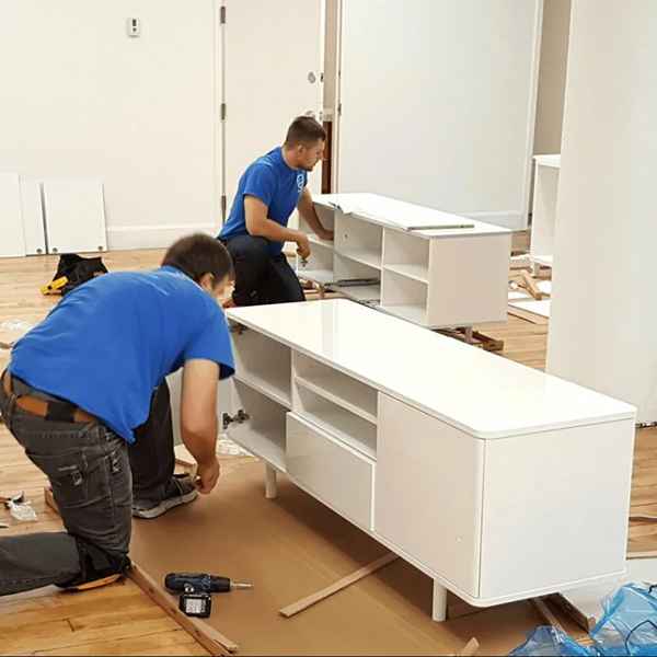 Furniture Assembling 25 Carpenters assembling white cabinet furniture