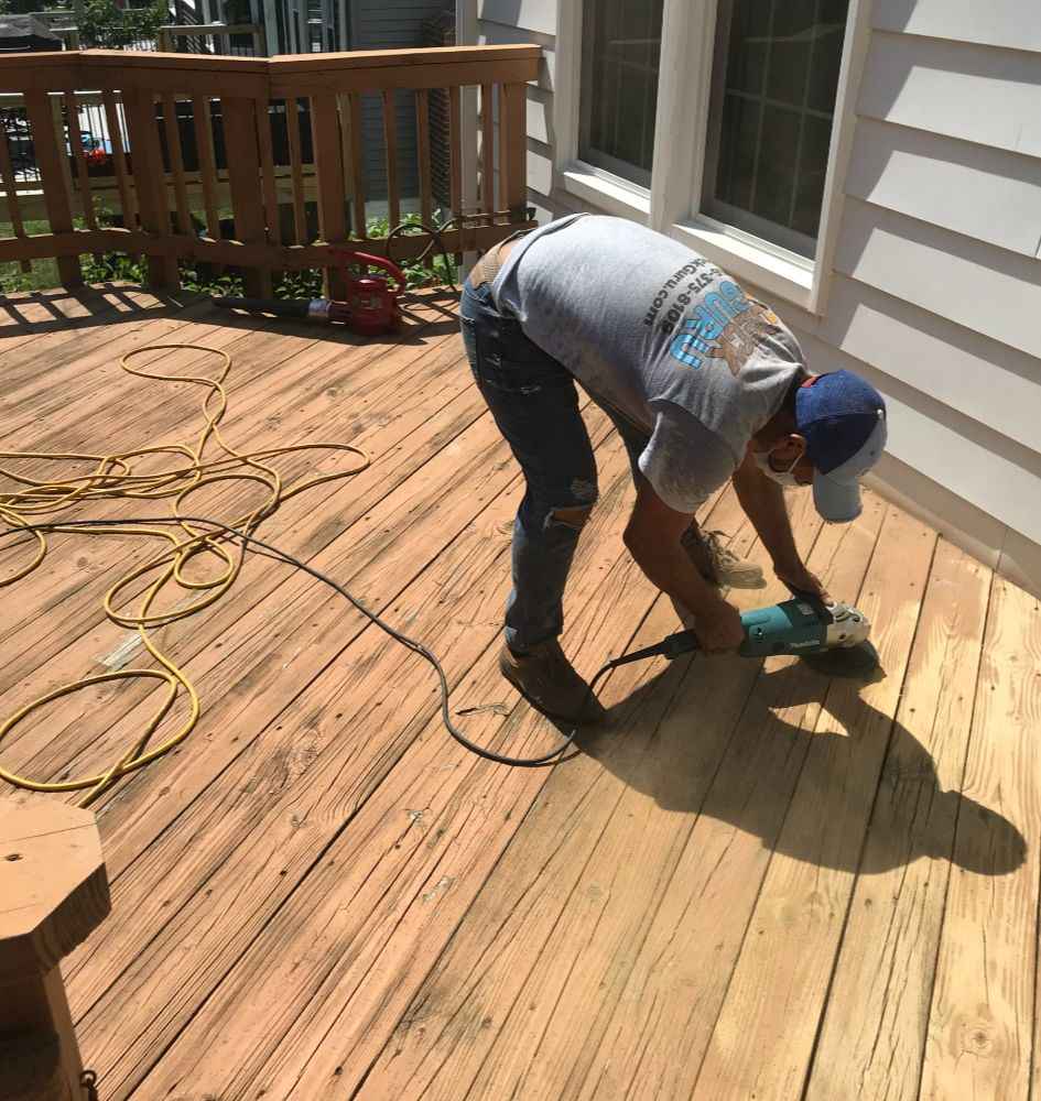 Deck Repair 51 Worker repairing wooden deck