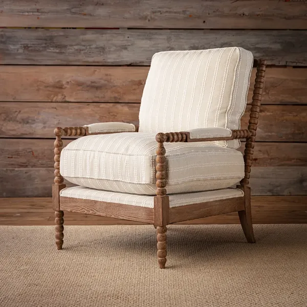 White upholstered wooden armchair